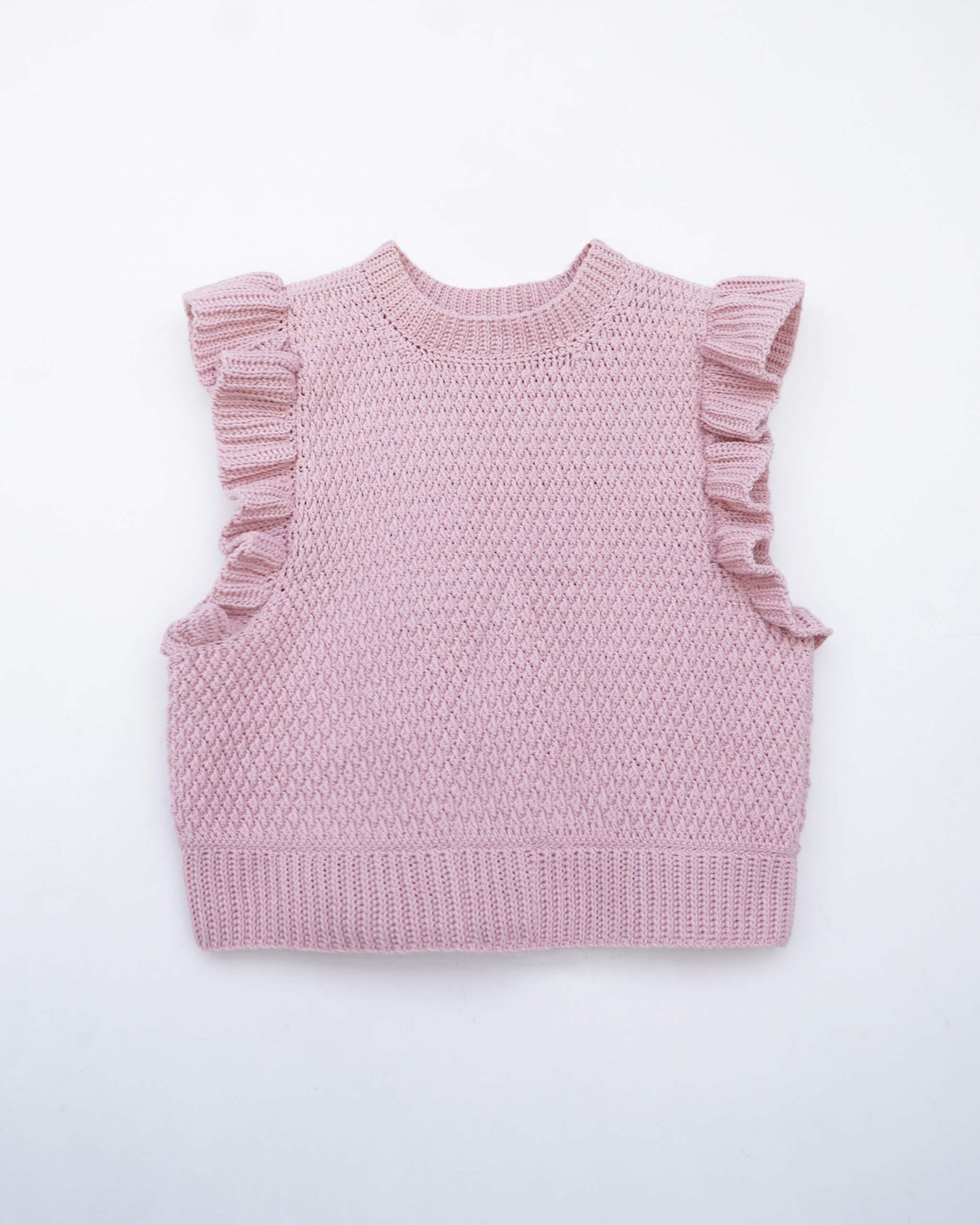 Pink crochet vest with ruffled sleeves on a white background